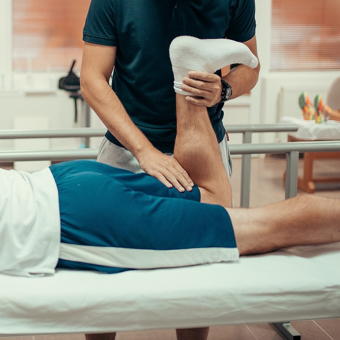 Physiotherapist providing hands-on physiotherapy care to a patient